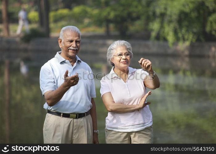 Happy couple smiling while enjoying at park