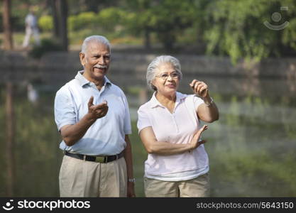 Happy couple smiling while enjoying at park