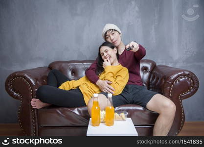 Happy Couple stay at home watching movies