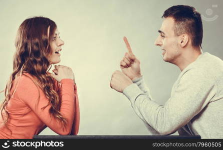 Happy couple talking and laughing on date. Smiling girl and guy having conversation. Amusing man making woman laugh. Good relationship. Instagram filtered.. Happy couple talking on date. Conversation.