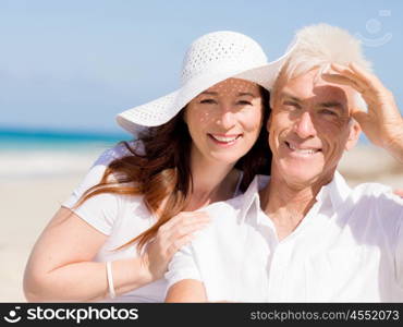 Happy couple together on the beach. Just us and the ocean