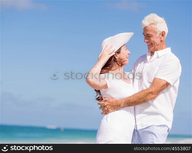 Happy couple together on the beach. Just us and the ocean
