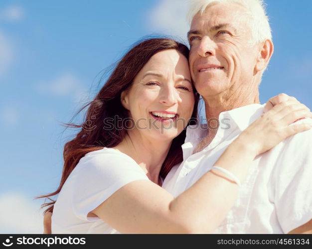 Happy couple together on the beach. Just us and the ocean