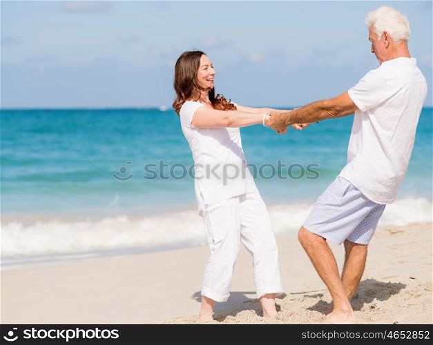 Happy couple together on the beach. Just us and the ocean