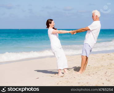 Happy couple together on the beach. Just us and the ocean