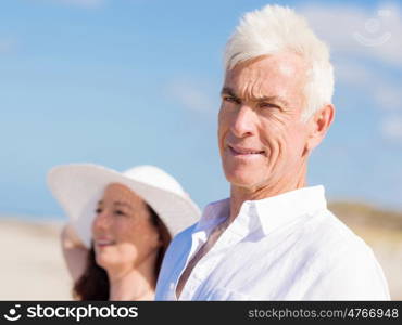 Happy couple together on the beach. Just us and the ocean