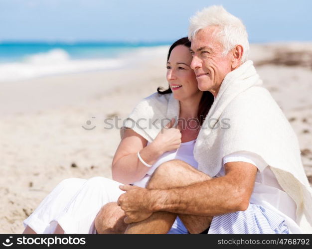 Happy couple together on the beach. Just us and the ocean