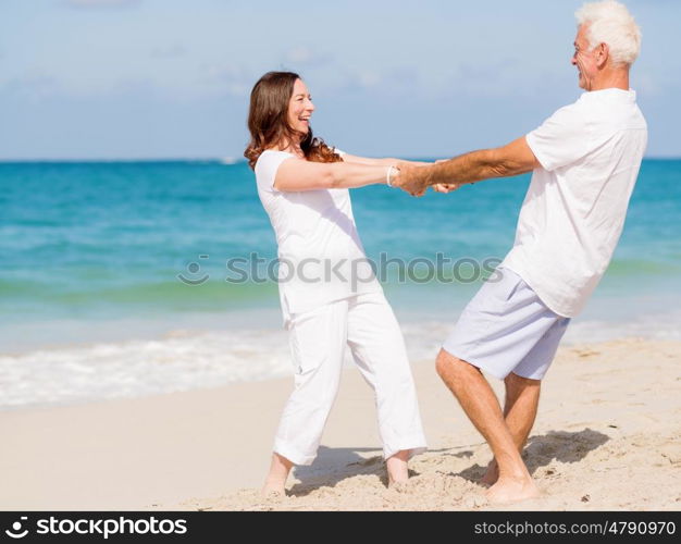 Happy couple together on the beach. Just us and the ocean