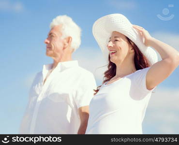 Happy couple together on the beach. Just us and the ocean