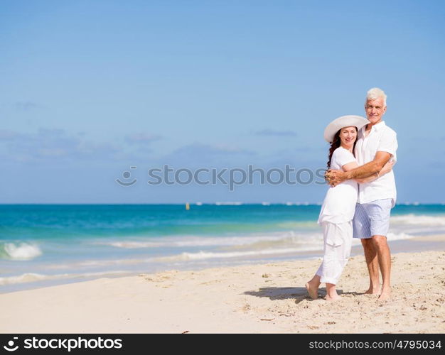 Happy couple together on the beach. Just us and the ocean