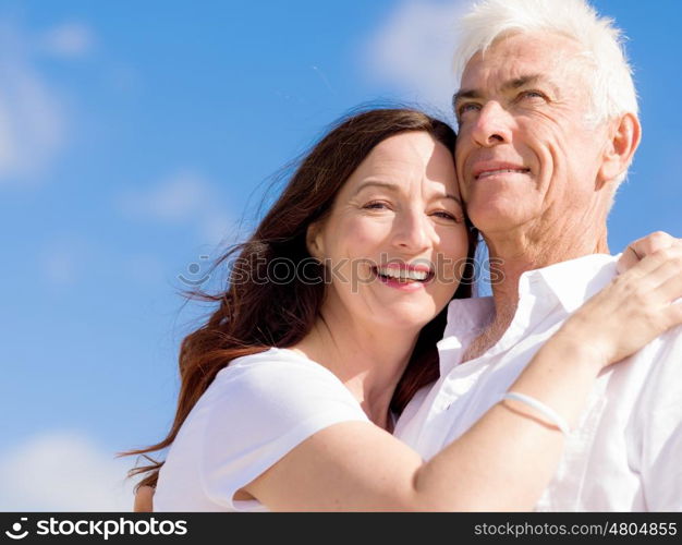 Happy couple together on the beach. Just us and the ocean