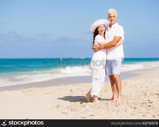 Happy couple together on the beach. Just us and the ocean