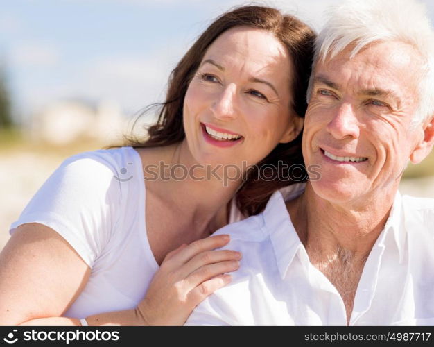 Happy couple together on the beach. Just us and the ocean