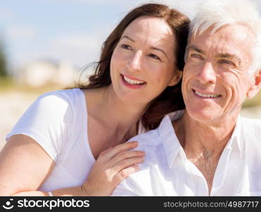 Happy couple together on the beach. Just us and the ocean