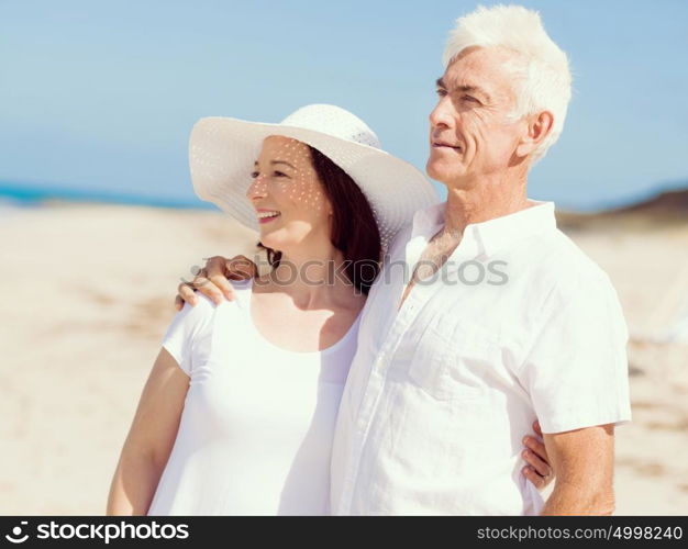 Happy couple together on the beach. Just us and the ocean