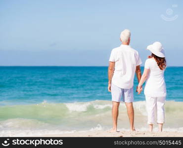 Happy couple together on the beach. Just us and the ocean