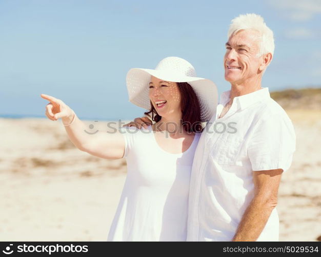 Happy couple together on the beach. Just us and the ocean