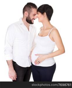 Happy couple waiting for a baby, handsome guy with his beautiful pregnant wife isolated on white background, looking on each other, love concept
