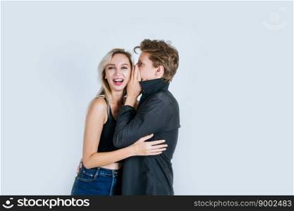 Happy couple whispering something