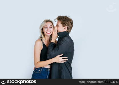 Happy couple whispering something