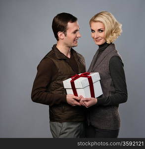 Happy couple with gift box