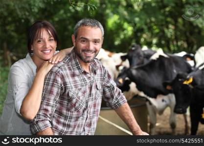 happy couple working in their farm