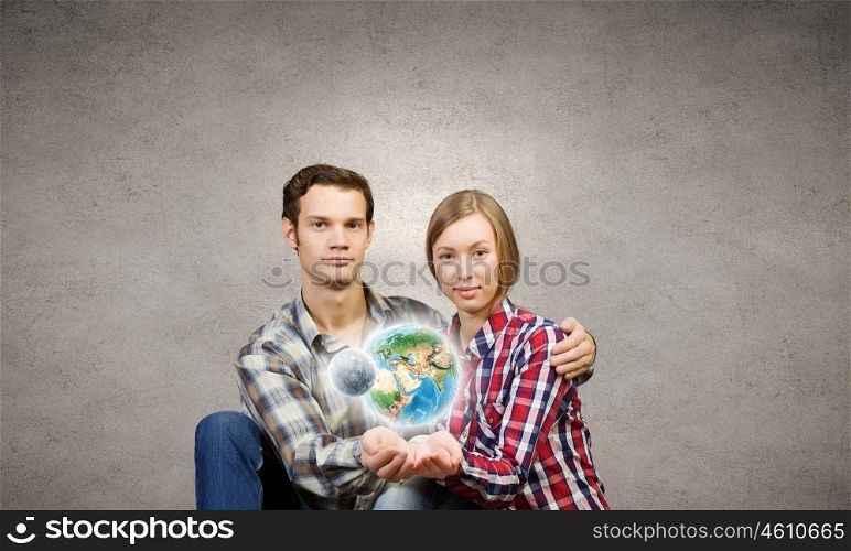 Happy couple. Young happy couple hugging each other. Elements of this image are furnished by NASA