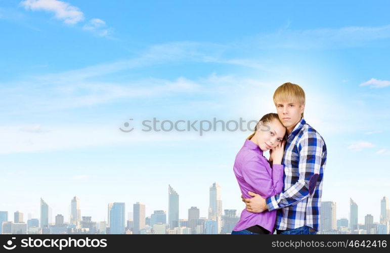 Happy couple. Young happy couple hugging each other tenderly