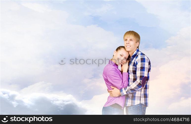 Happy couple. Young happy couple hugging each other tenderly