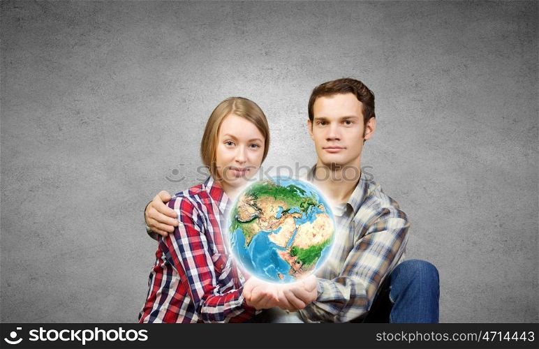 Happy couple. Young happy couple hugging each other tenderly. Elements of this image are furnished by NASA