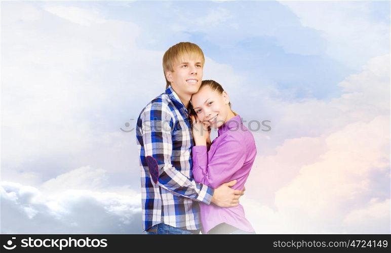 Happy couple. Young happy couple hugging each other tenderly