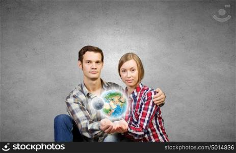 Happy couple. Young happy couple hugging each other tenderly. Elements of this image are furnished by NASA