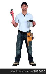 happy craftsman holding a spanner and a welding torch