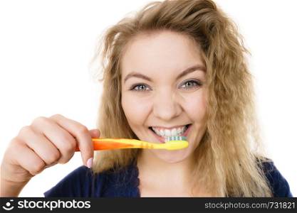 Happy crazy blonde woman brushing teeth having crazy tangled hair. Oral hygiene concept, isolated background.. Happy positive woman brushing teeth, isolated