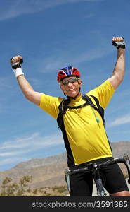 Happy Cyclist Cheering with Arms Raised