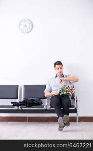 Happy dad waiting for news in maternity house