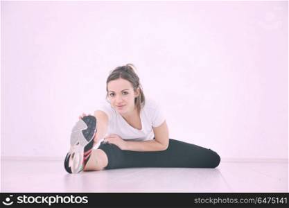 happy diet concept with young woman on pink scale at sport fitnes gym club. young woman fitness workout