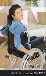happy disabled woman in wheelchair