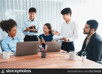 Happy diverse business people work together, discussing in corporate office. Professional and diversity teamwork discuss business plan on desk with laptop. Modern multicultural office worker. Concord. Modern multicultural office worker in corporate workplace. Concord