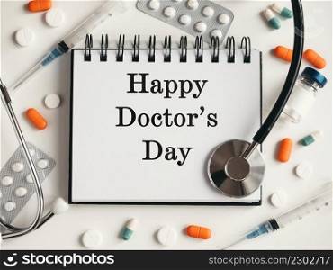 Happy Doctor’s Day. Greeting Card. Close-up, view from above, nobody. Concept of preparation for a professional holidays. Congratulations for loved ones, relatives, friends and colleagues. Happy Doctor’s Day. Greeting Card. Close-up, top view
