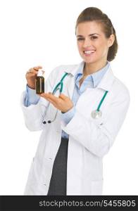 Happy doctor woman holding medicine bottle