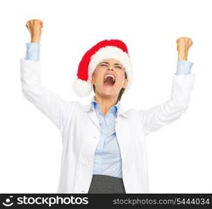 Happy doctor woman in santa hat rejoicing success