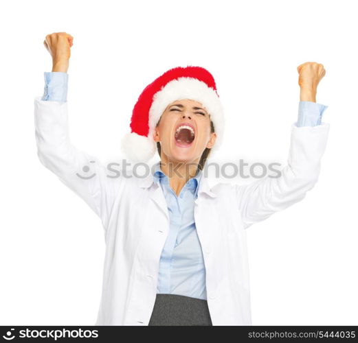 Happy doctor woman in santa hat rejoicing success