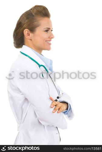 Happy doctor woman looking on copy space