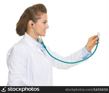 Happy doctor woman using stethoscope
