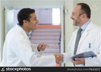 happy doctors doing a handshake