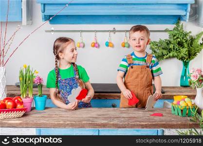 Happy easter. Cute brother and sister, funny kids boy and girl are preparing for the holiday. Easter decoration.. Happy easter. Cute brother and sister, funny kids boy and girl are preparing for the holiday.