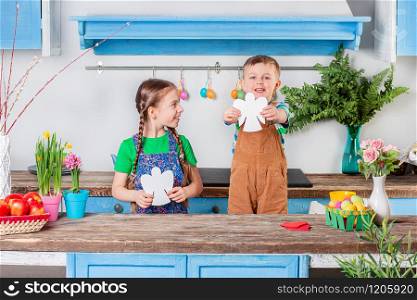 Happy easter. Cute brother and sister, funny kids boy and girl are preparing for the holiday. Easter decoration.. Happy easter. Cute brother and sister, funny kids boy and girl are preparing for the holiday.