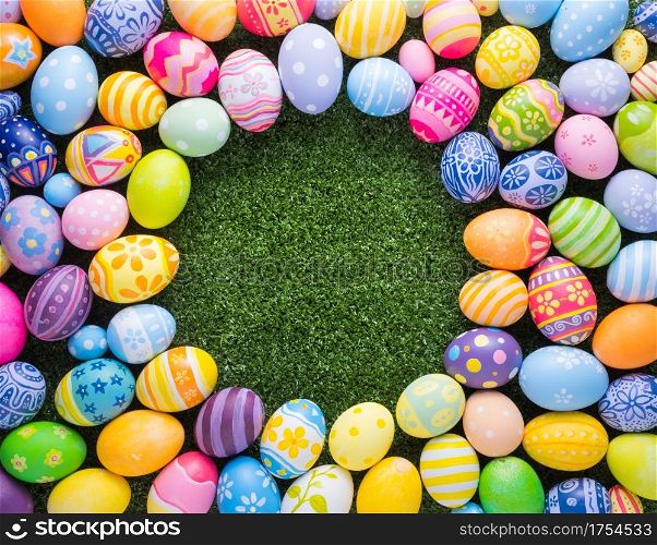Happy Easter day decoration colorful eggs shape on the grass background with copy space.