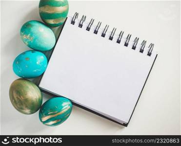 Happy Easter. Easter eggs painted with colorful paints. Closeup, indoors, no people, view from above Congratulations for loved ones, relatives, friends, colleagues. Happy Easter. Easter eggs painted with colorful paints